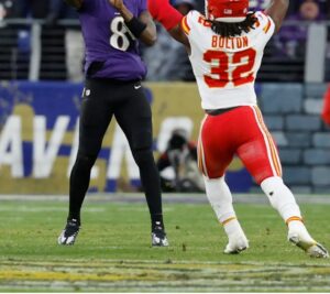 Jan 28, 2024; Baltimore, Maryland, USA; Baltimore Ravens quarterback Lamar Jackson (8) throws the ball past KC Chiefs linebacker Nick Bolton (32) during the first half in the AFC Championship football game at M&T Bank Stadium. Mandatory Credit: Geoff Burke-USA TODAY Sports (Kansas City Chiefs Patrick Mahomes)