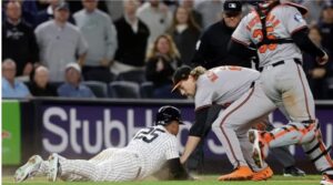 Gunnar Henderson #2 of the Baltimore Orioles tags out Gleyber Torres #25 of the New York Yankees to end the seventh inning at Yankee Stadium on September 24, 2024 in New York City. (Photo by Jim McIsaac/Getty Images)